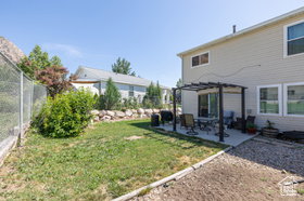 View of yard with a pergola and a patio