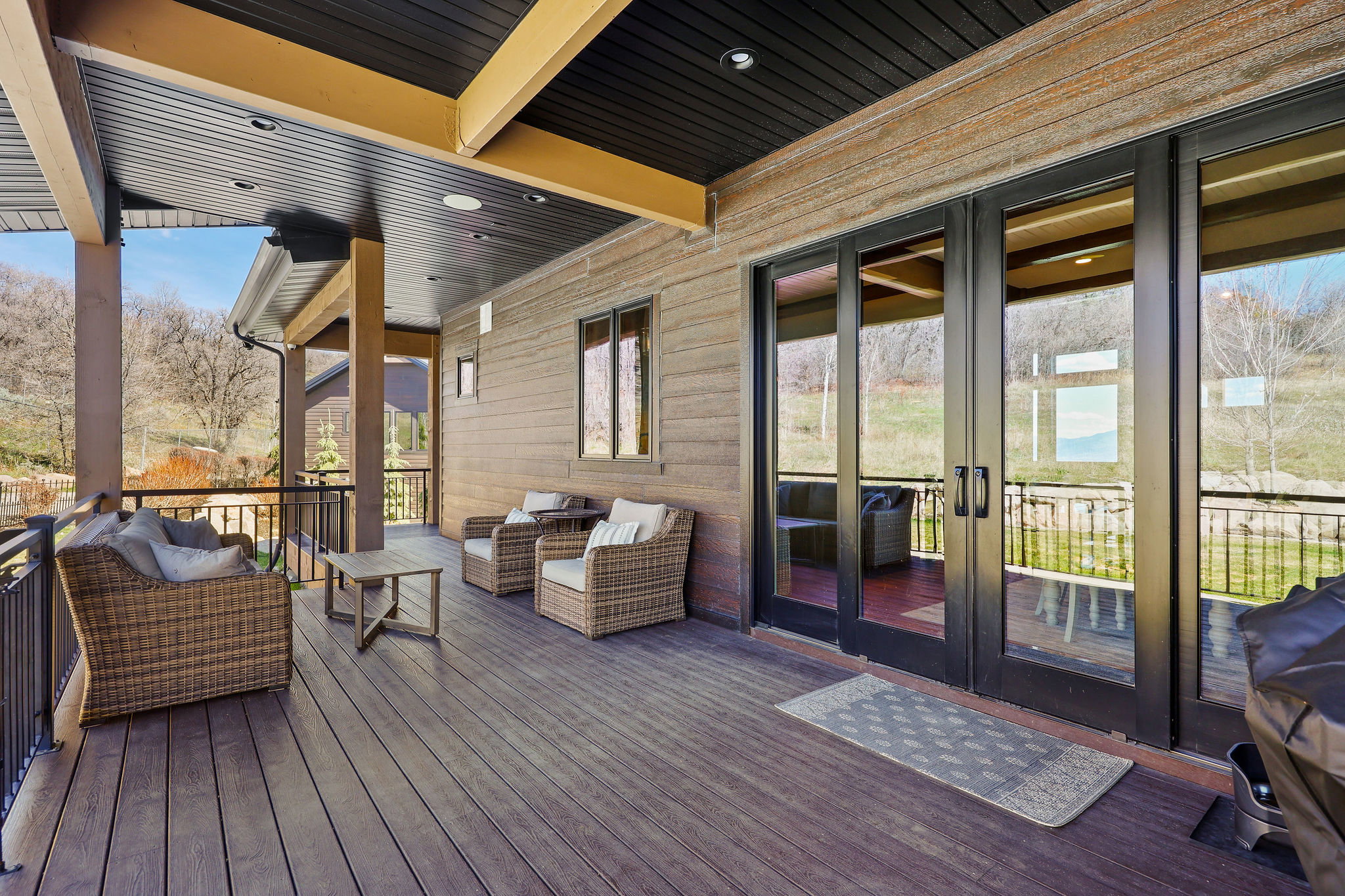 Wooden terrace featuring an outdoor living space and french doors