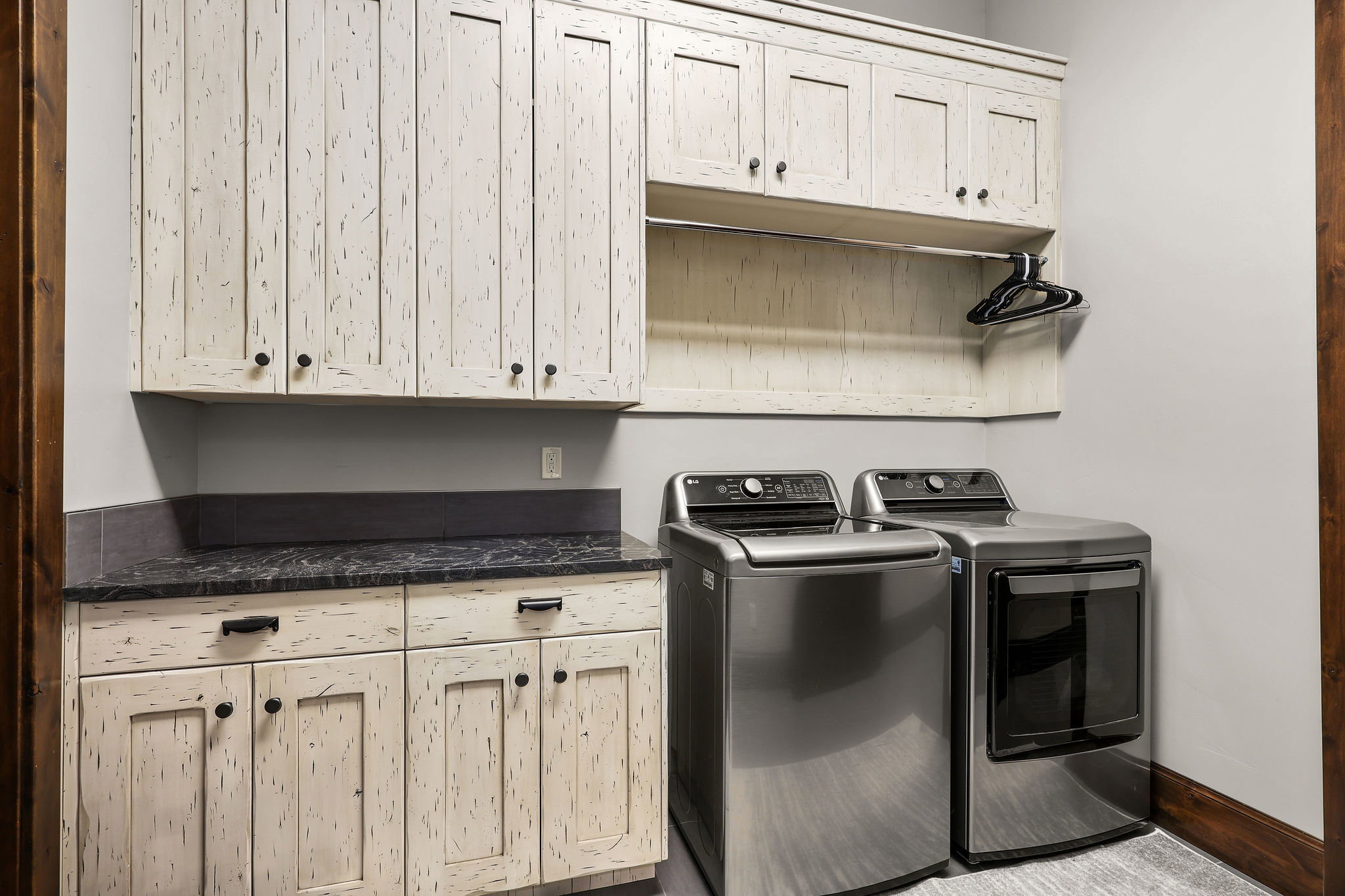 Laundry room with washer and dryer and cabinet space