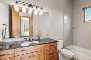 Full bathroom with vanity and bathing tub / shower combination