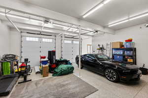 Garage featuring a garage door opener