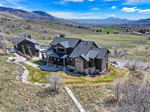 View of subject property featuring mountains