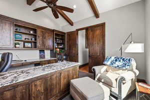 Office with built in desk, vaulted ceiling with beams, a ceiling fan, dark wood-style floors, and recessed lighting