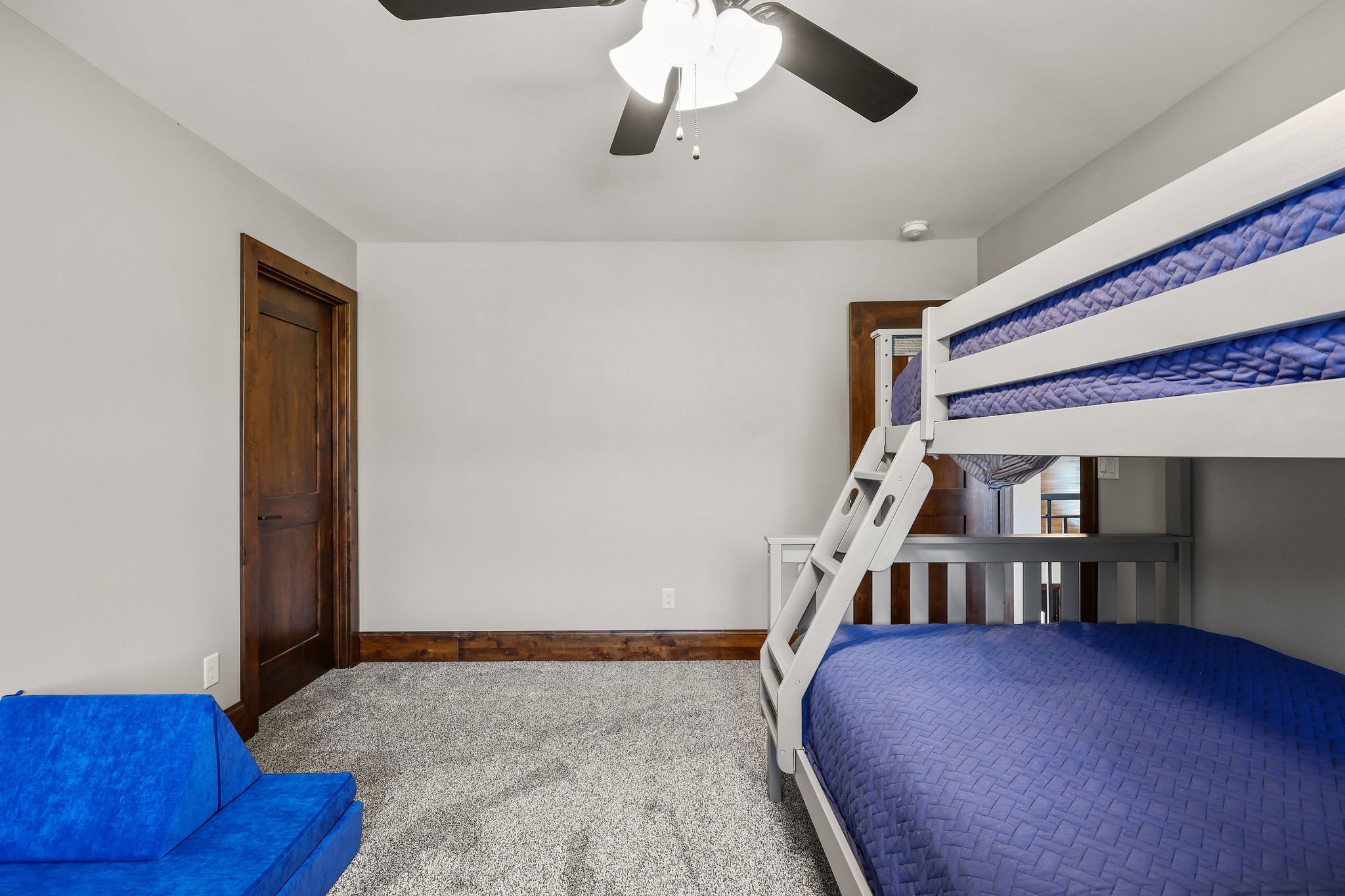 Bedroom with carpet floors and a ceiling fan