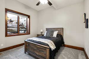 Bedroom featuring carpet and ceiling fan