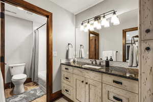 Full bath featuring vanity, shower / bath combination with curtain, and light wood finished floors