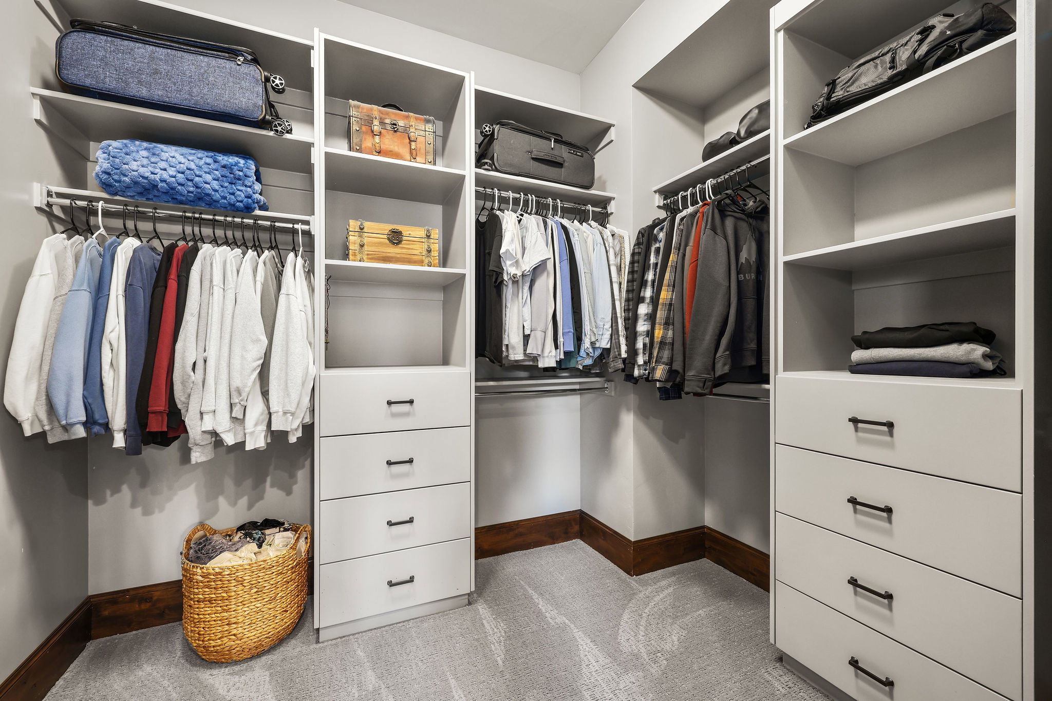 Walk in closet with light carpet