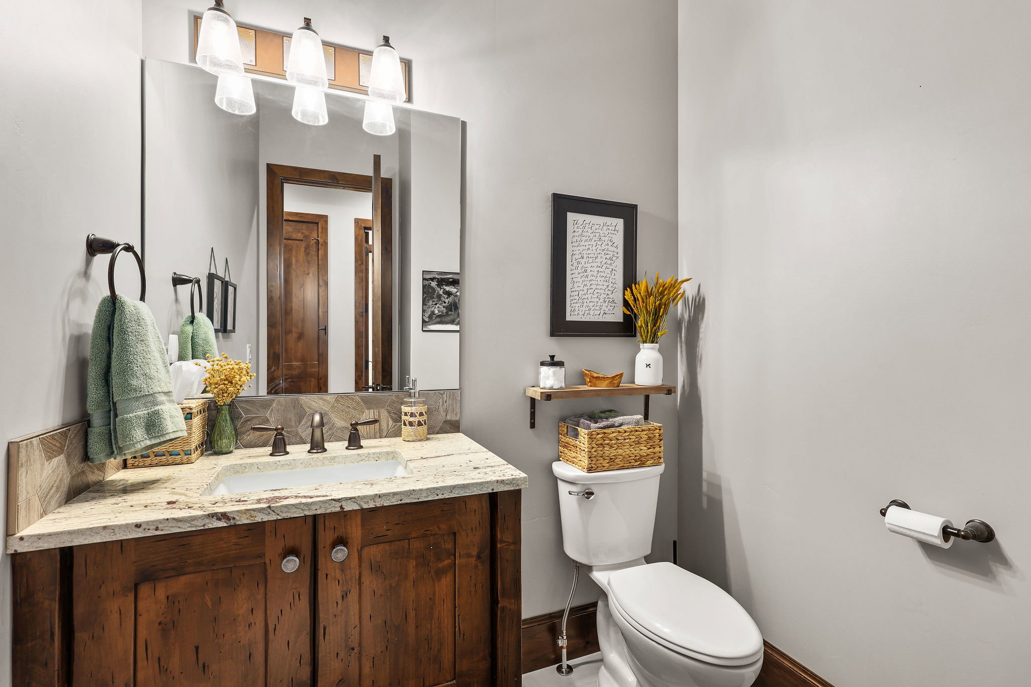 Half bath featuring toilet and vanity