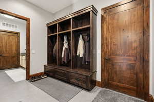 Mudroom featuring light tile patterned flooring