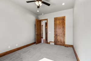 Unfurnished room featuring carpet floors, a ceiling fan, and recessed lighting