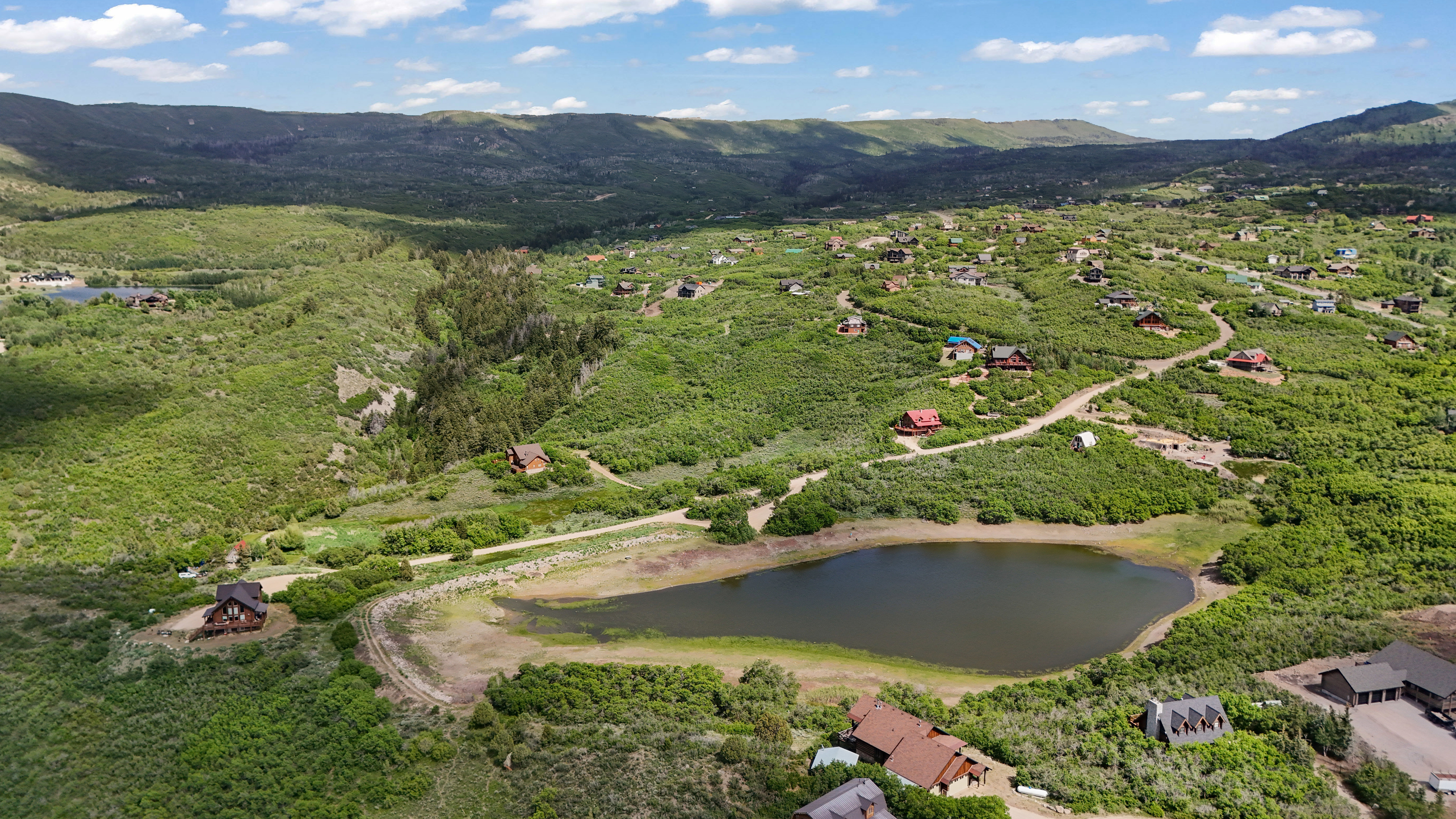 View of property location featuring a water and mountain view