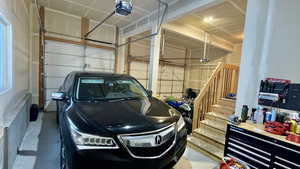 Garage featuring a garage door opener