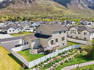 Aerial perspective of suburban area with a mountainous background