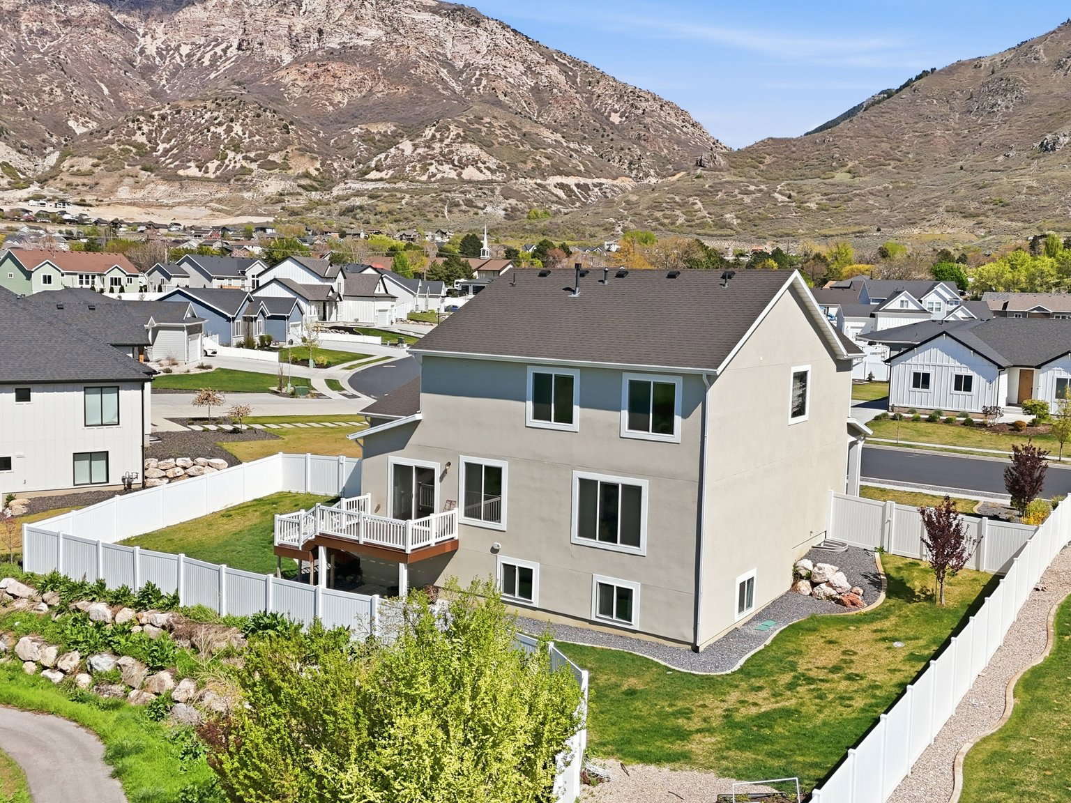 View of mountain backdrop featuring nearby suburban area
