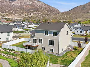 View of mountain backdrop featuring nearby suburban area