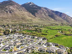 Aerial view of residential area featuring a mountain backdrop