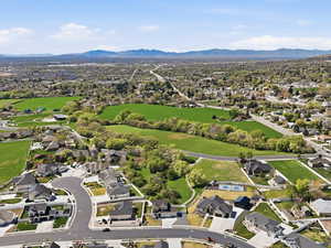 Aerial perspective of suburban area with a mountainous background