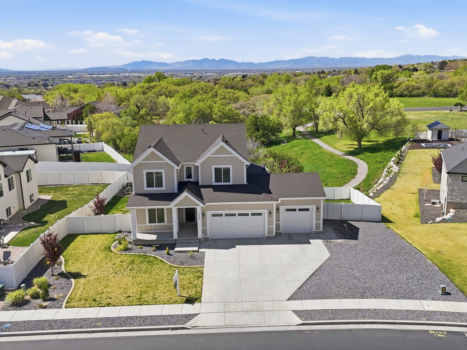Aerial view of residential area featuring a mountain backdrop