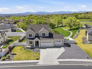 Aerial view of residential area featuring a mountain backdrop