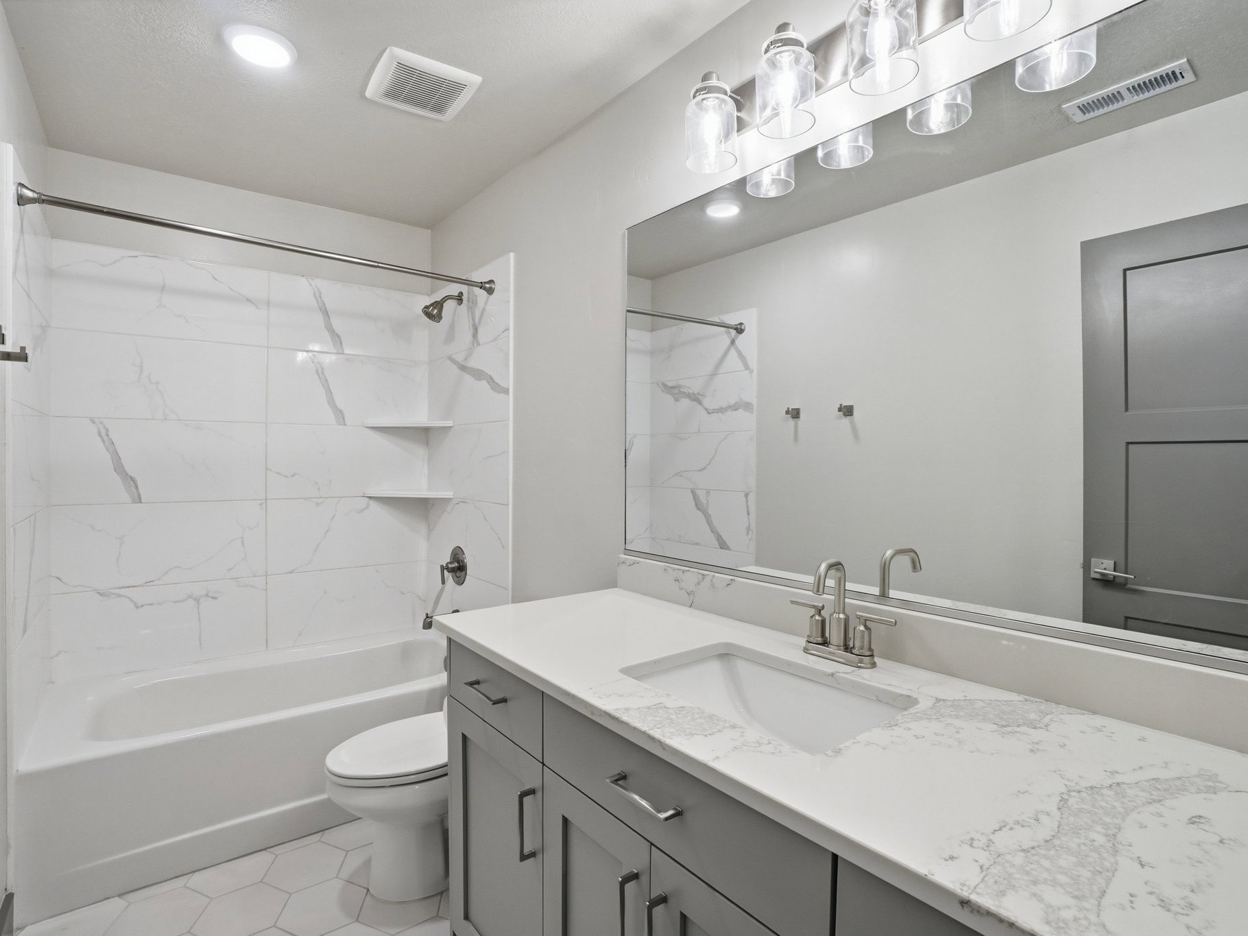 Bathroom featuring vanity and tub / shower combination