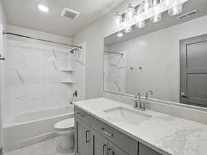 Bathroom featuring vanity and tub / shower combination