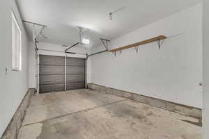 Garage featuring a garage door opener