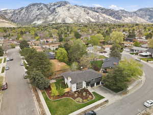 Aerial perspective of suburban area featuring a mountain backdrop