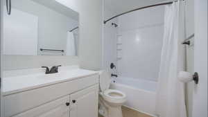 Full bath with vanity and shower / tub combo with curtain