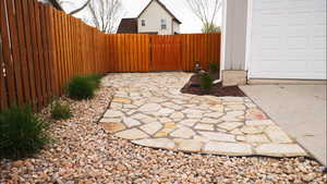 View of patio featuring a gate