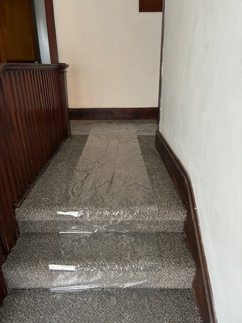 Staircase featuring baseboards