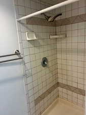 Full bathroom featuring a shower stall