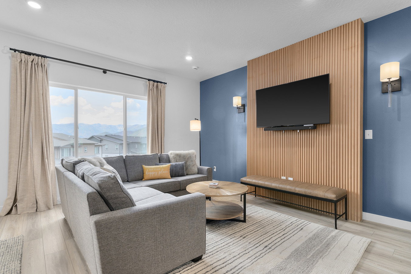 Living room featuring fluted paneling and lovely space to relax and unwind.