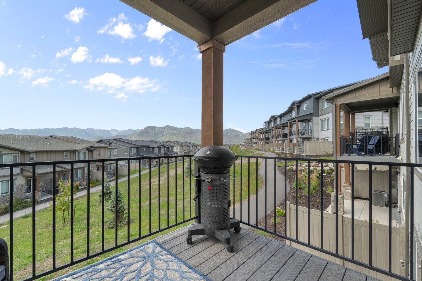 Balcony off the dining and living space. Great open space and mountain views!