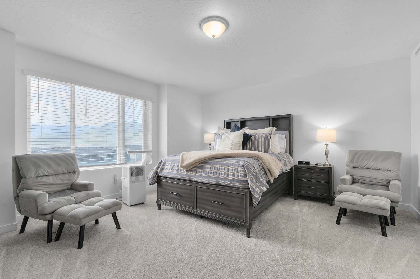 Primary bedroom with great space and mountain views a walk in closet and own en suite bathroom.