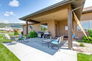 View of patio / terrace featuring a grill and a mountain view