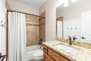 Bathroom with vanity and shower / tub combo