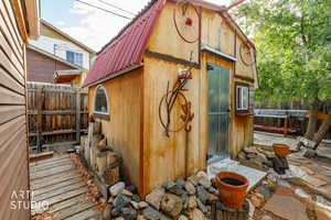 View of outdoor structure featuring a fenced backyard