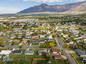 Aerial perspective of suburban area with a mountainous background
