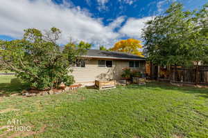 Back of property featuring a garden