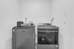 Laundry area with washer and clothes dryer