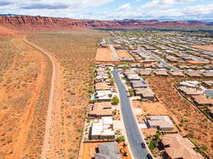 Aerial view of residential area featuring a mountainous background