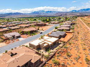Aerial perspective of suburban area featuring a mountain backdrop