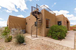 View of building exterior featuring stairs