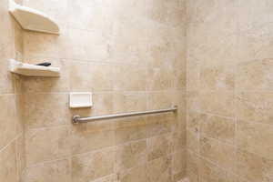 Bathroom featuring a tile shower