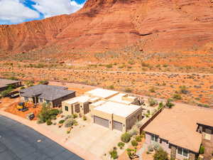Overview of rural landscape with a desert landscape and a mountain backdrop