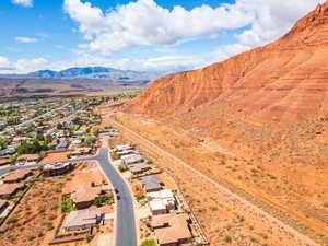 Aerial perspective of suburban area with a mountainous background