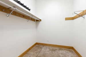 Walk in closet featuring light tile patterned flooring