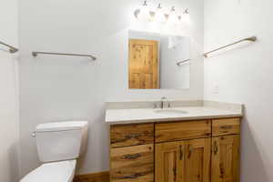 Half bath with toilet and vanity