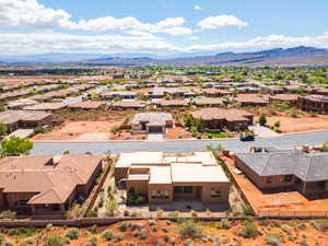 Aerial view of residential area featuring a mountain backdrop