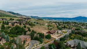 Aerial view of residential area featuring a mountain backdrop